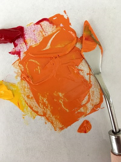 Mixing red and yellow pigments for orange