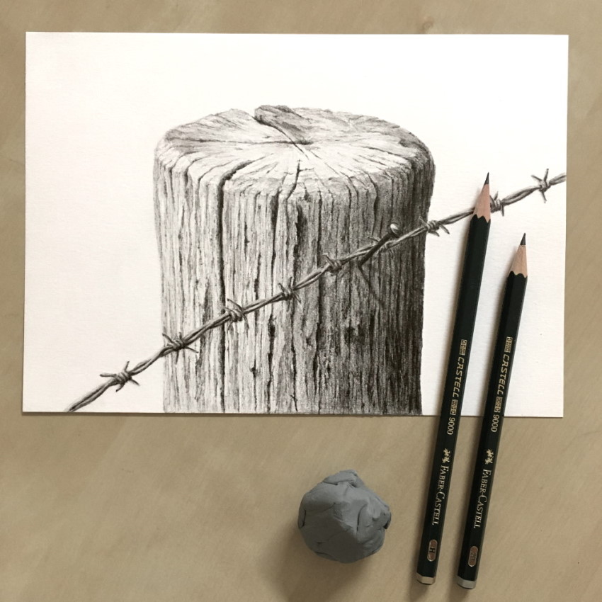 Wooden pole with barbed wire drawing